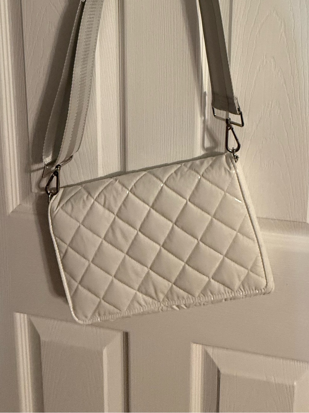 Quilted glossy White Crossbody Bag with Adjustable Strap. Never used